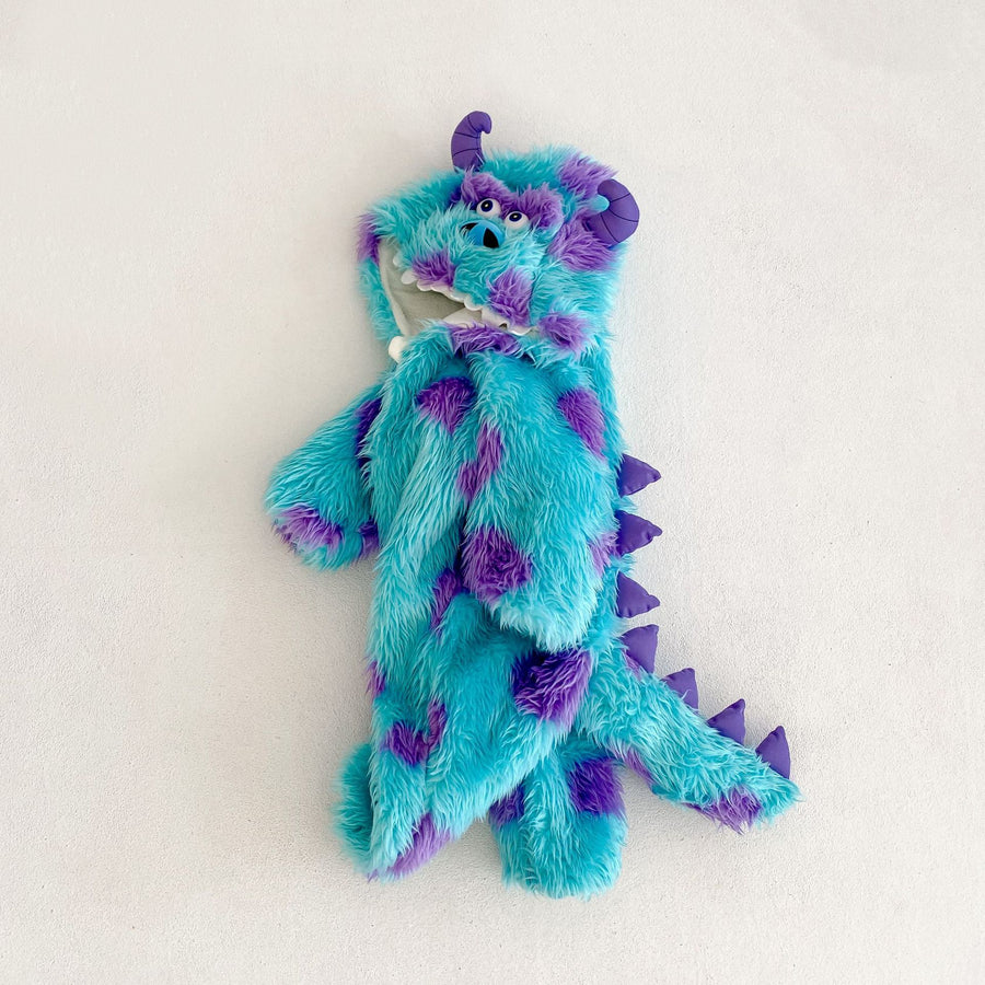 The whole jumpsuit laid flat, hood at the top and the purple spike ridge running down to the tail